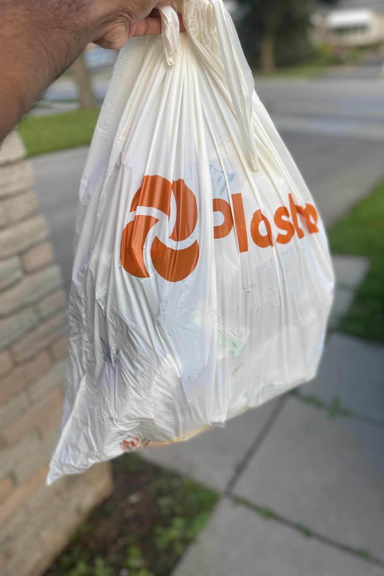 Taking Plastno biodegradable garbage bags to the curb